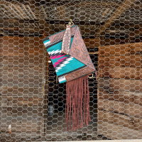 Saddle blanket bag with tooled leather 