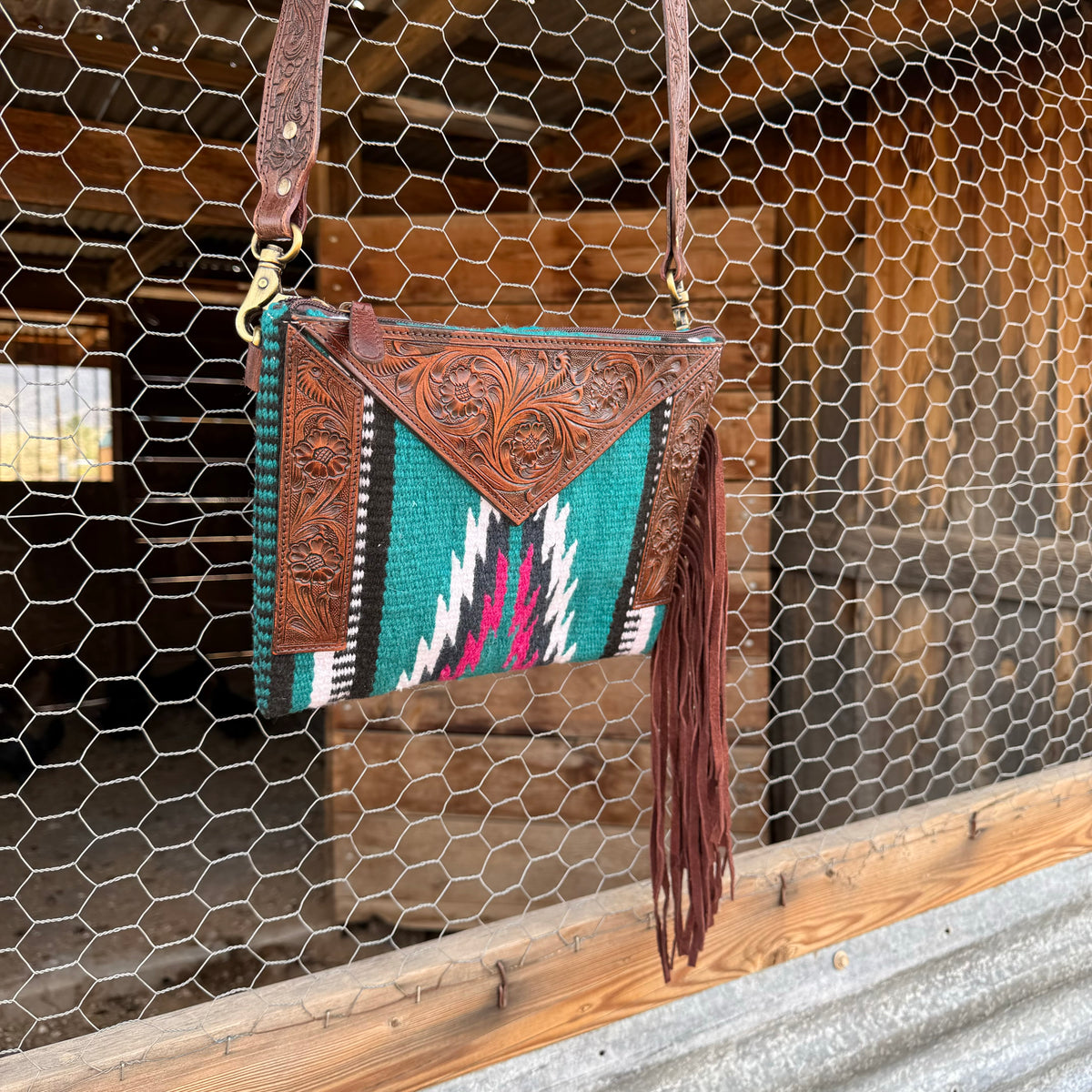 Saddle blanket bag with tooled leather 